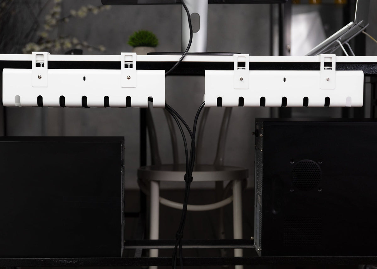 Clean minimalist desk setup with Yelvio cable management tray hidden under desk.