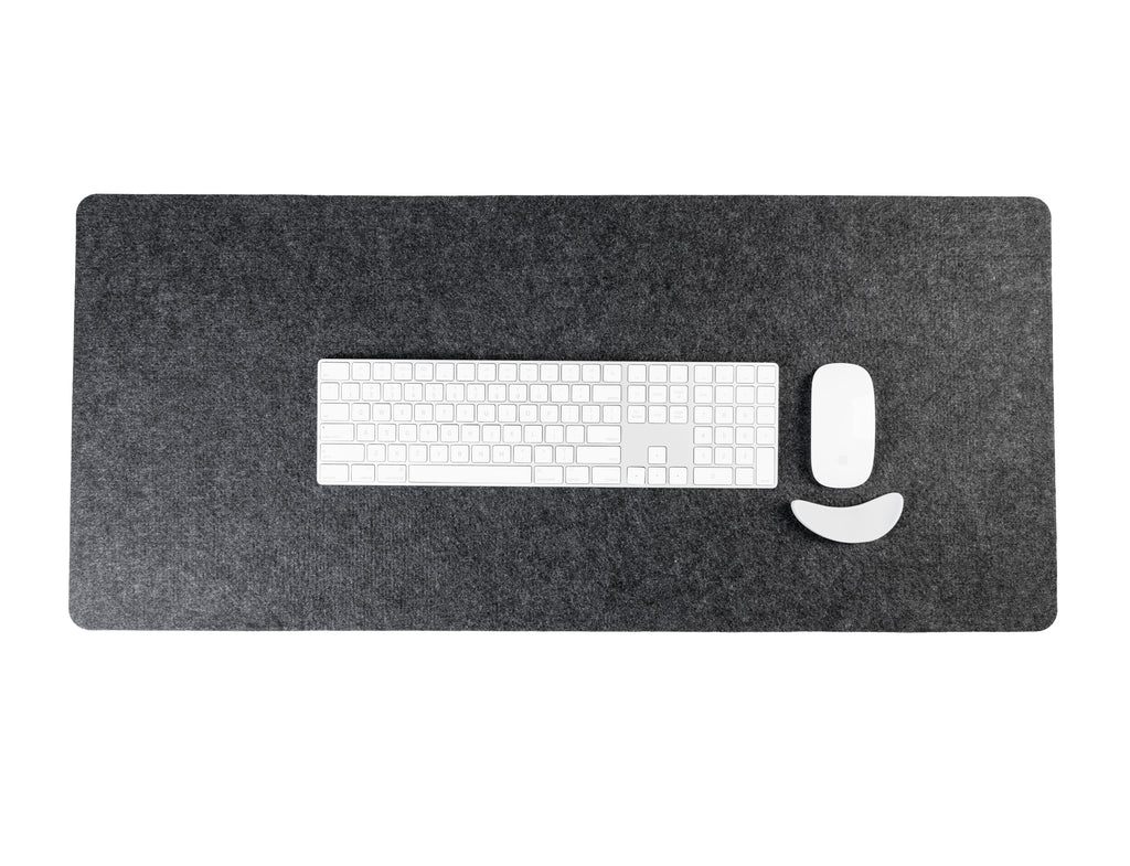 Gray desk mat with a cutout for a keyboard on a white background