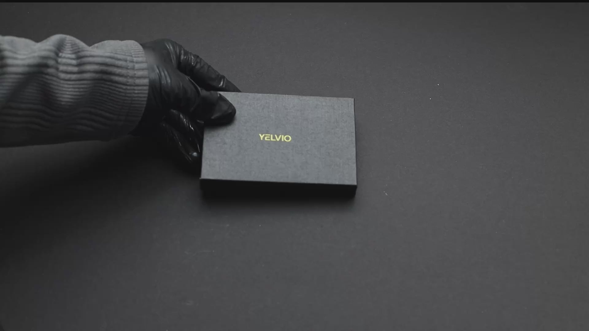 Yelvio VaultStrap S1 pop-up wallet mechanism fanning out cards and cash strap demonstration.