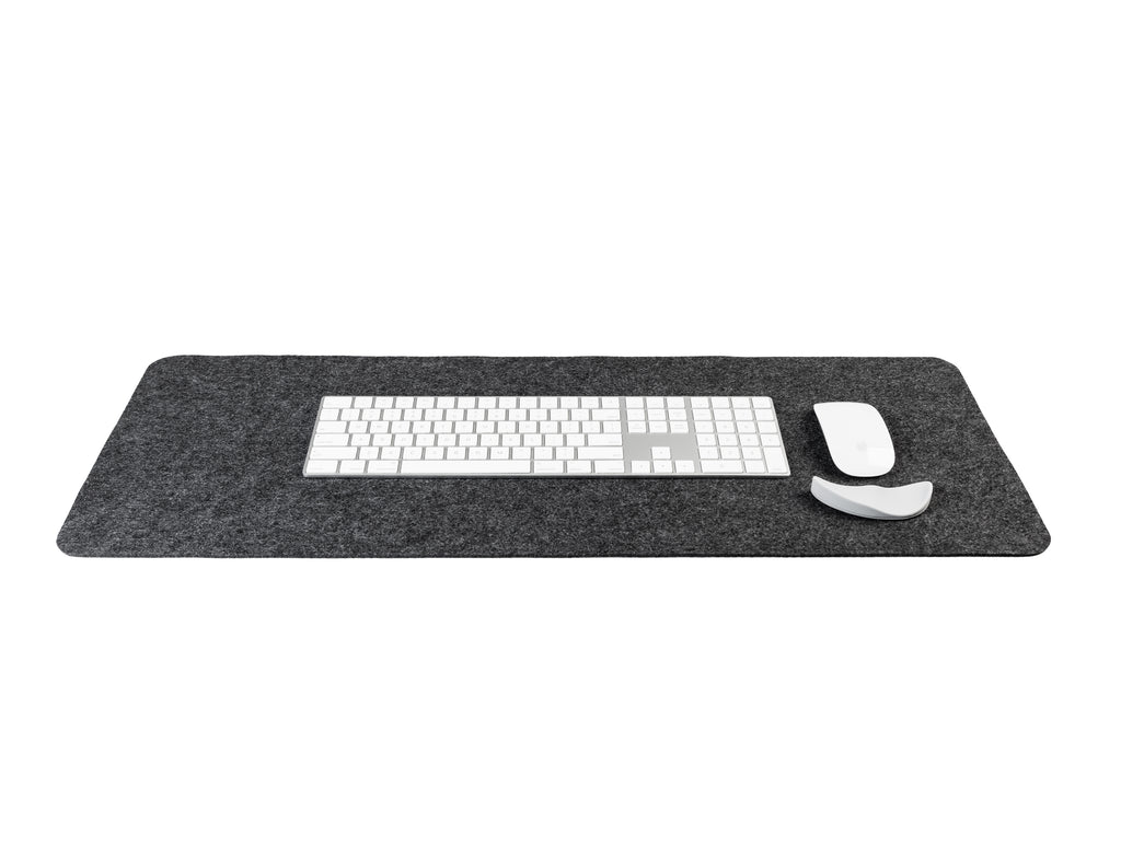 Gray desk mat with a keyboard and mouse on a white background
